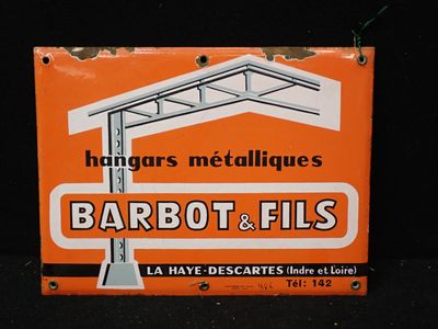 une enseigne portant l'inscription « Barbot Fils » sur la façade d'un immeuble