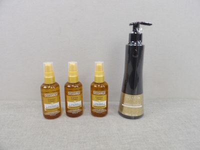 trois bouteilles de liquide et une bouteille de liquide posées sur une table