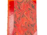 orange and black marbled paper with a red ribbon on a white background
