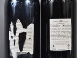two bottles of wine sitting next to each other on a table