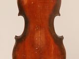 an old violin with a wooden back and a long neck