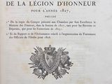 an old book with a black and white image of a coat of arms