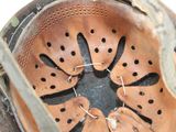 a close up view of a helmet with holes in it