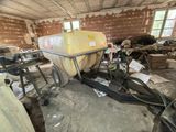 an image of a room with a tractor and a cart