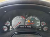 a close up of a car dashboard with various gauges