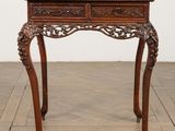 an old wooden table with a drawer on top of it
