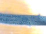 a close up of a knife with writing on it