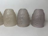 four vases that are lined up in a row