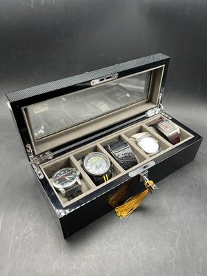 an image of a watch box with a watch inside of it