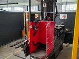 a fork lift truck parked inside of a building