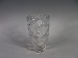 a clear glass vase sitting on a white surface
