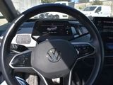 the interior of a car with a steering wheel and dashboard controls
