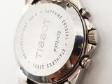 an image of a close up of a wrist watch on a white surface