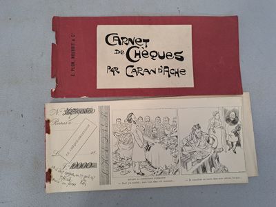 two pages of comics on a table with a red cover