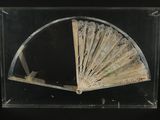 a glass display case with a fan inside of it