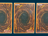 three cards with a picture of a black hole in the middle of them