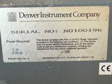 a label on the back of a machine that says denver instrument company