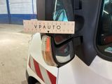 a close up of a car mirror with a sticker on it