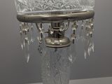 a glass lamp that is sitting on a table