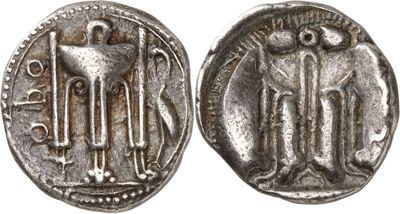 a silver coin with an image of a man and a woman on it