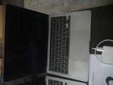 two laptops that are sitting next to each other on a table