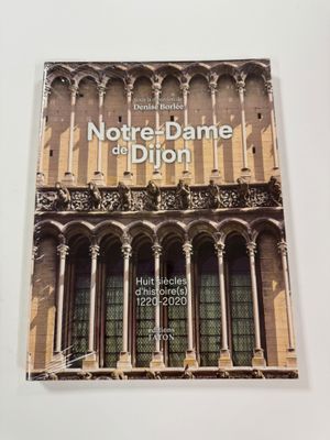 the front cover of a book with a building in the background