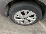 a close up of a tire on a car in a parking lot