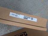 a cardboard box with a sticker on it sitting on the floor