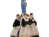 a figurine of a woman and a man on top of a cake