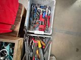 many different tools in a box on the floor