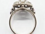 a close up of a ring with a diamond on top of it
