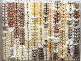 many different types of butterflies on display in a display case