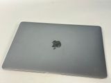 an apple macbook pro laptop sitting on top of a white table