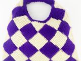 purple and white crocheted bag on a white background
