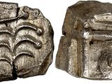 une image représentant une pièce d'argent sur laquelle figure un visage