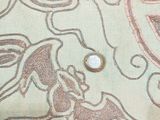 a close up of a table cloth with a design on it