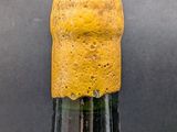 a bottle of wine that has a cork on it