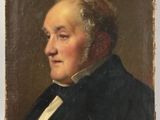 portrait of a man in a black coat and white shirt