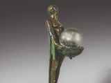 an image of a statue of a woman holding a pearl