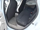 a white car with black seats and a black seat belt