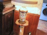 a lamp that is sitting on a table in a room