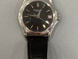 wrist watch with black leather strap on white background