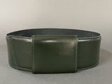 a green belt with a metal buckle on it