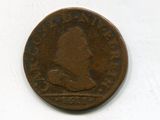 une vieille pièce de monnaie sur laquelle figure l'image d'un homme