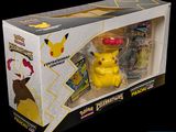 a box with a pokemon figure and a toy in it