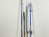 two fishing poles are leaning against a wall in a room