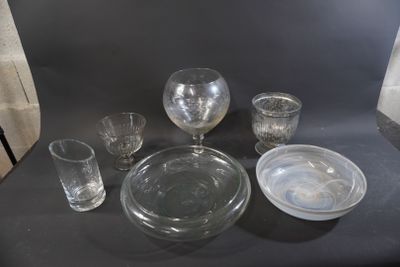 a lot of glassware on a table with a black background