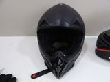 a helmet, gloves and a helmet on a table