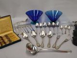 many spoons and spoon spoons and a box of forks and spoons