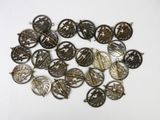 a close up of a bunch of metal buttons on a white surface